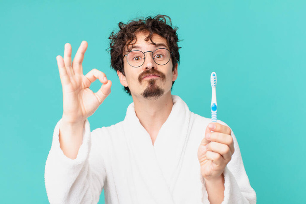 young crazy man with a teethbrush - Φωτογραφία, εικόνα