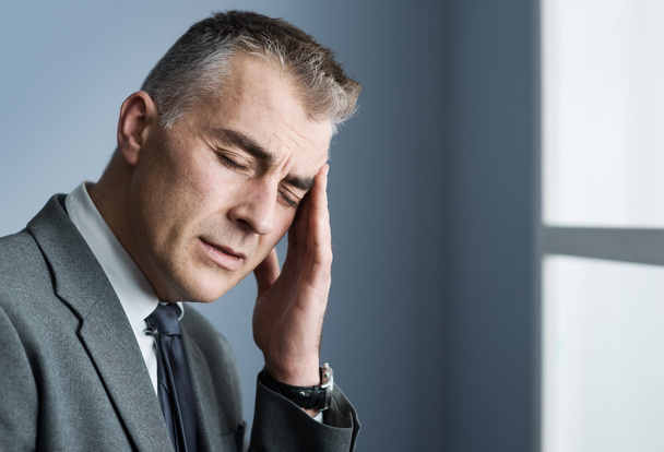 Stressed businessman with headache - Foto, Bild