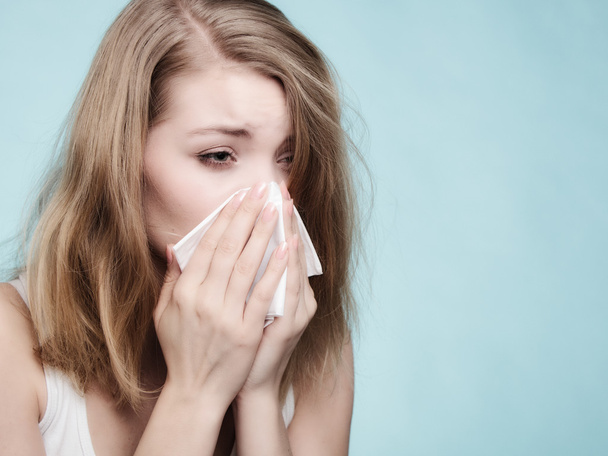 Sick girl sneezing in tissue. Health - Фото, зображення