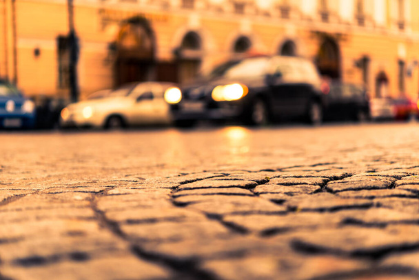 City central square paved with stone after a rain on which ridin - Foto, afbeelding