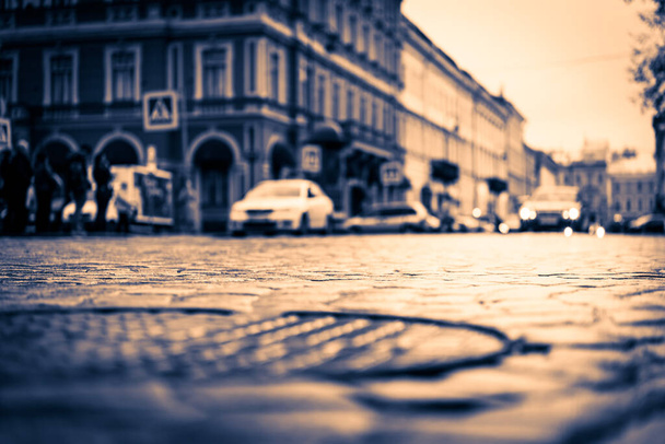 City central square after rain, car traveling on the street and  - Fotografie, Obrázek