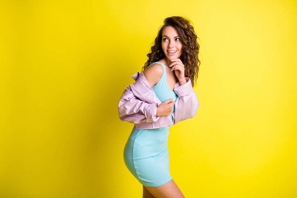 Profile side view portrait of pretty curious cheerful thin wavy-haired girl thinking copy space isolated over bright yellow color background - Φωτογραφία, εικόνα