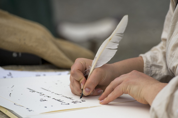 hands writing a letter with a plume - Fotó, kép