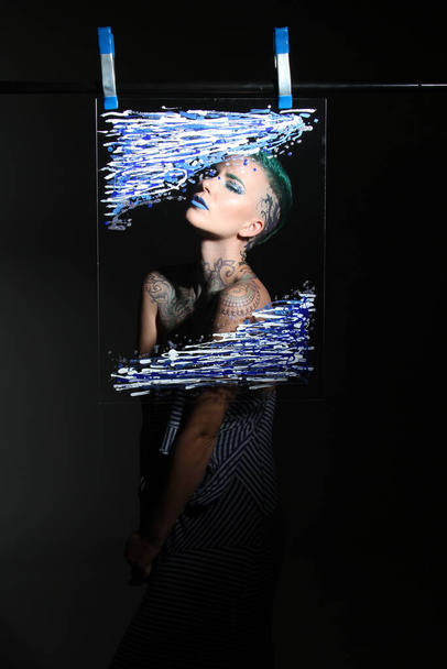 Photoshoot of a model behind glass - Photo, Image