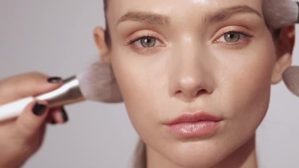 daily makeup routine brush on bored woman face - Felvétel, videó
