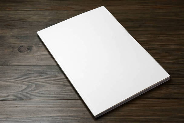 Blank paper brochure on wooden table. Mockup for design - Фото, зображення