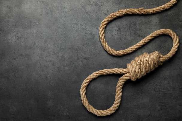 Rope noose with knot on grey table, top view. Space for text - Foto, immagini