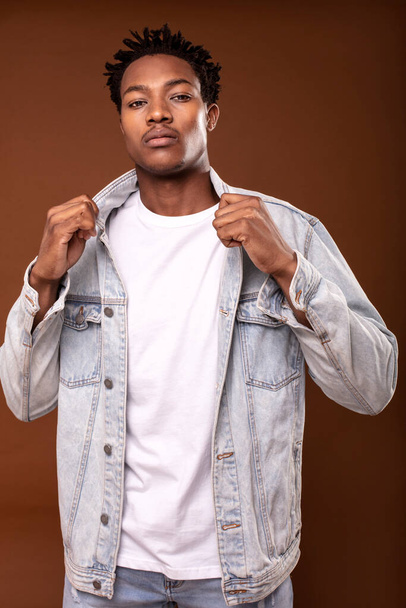 Handsome african american man  wearing casual jeans jacket, posing in studio. Fashionable outfit - Fotografie, Obrázek