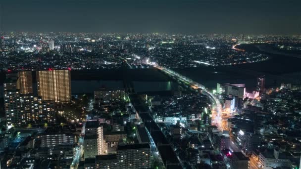 Tokió, Japán, Timelapse - Tokió városi forgalma éjszaka az Ichikawa I-link város obszervációs fedélzetéről - Felvétel, videó