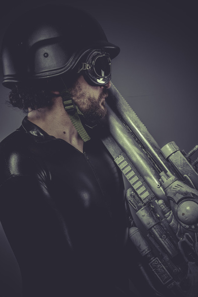 Future soldier with huge weapon - Φωτογραφία, εικόνα