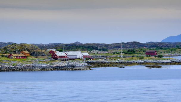 The red wooden houses on the Haholmen island, close to the Atlantic Ocean Road in Norway - Valokuva, kuva