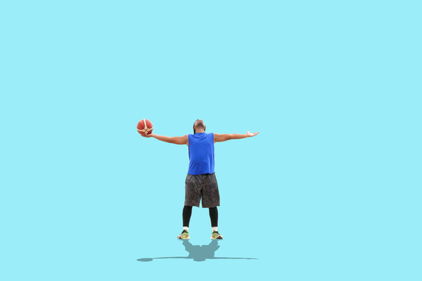 Basketball player on colored background - Photo, Image