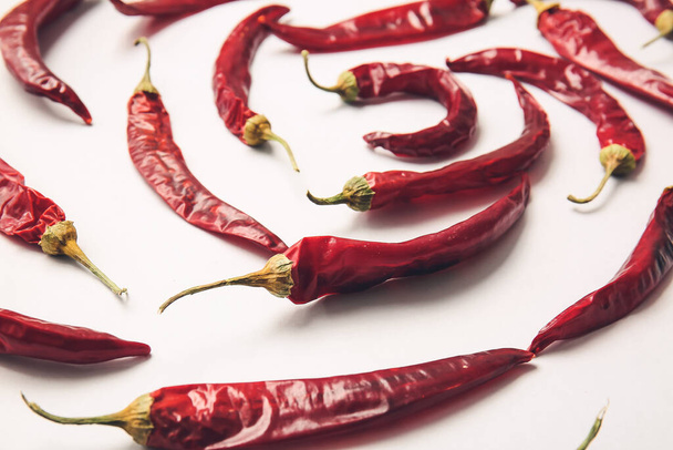 Dry hot chili peppers on white background - Photo, Image