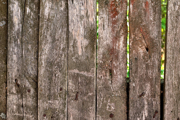 Old wooden fence. Aged texture, material. Beautiful background. Close-up - Fotó, kép