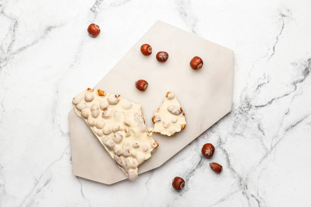 White chocolate with nuts on light background - Photo, Image