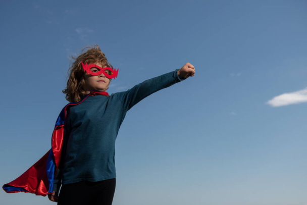 Excited child boy dressed like superhero. Super hero concept. - Photo, Image