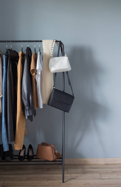 basic women's autumn wardrobe with shoes and handbags on  hanger - Zdjęcie, obraz