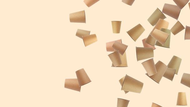falling brown paper disposable cups on pastel beige background, copy space - Photo, Image