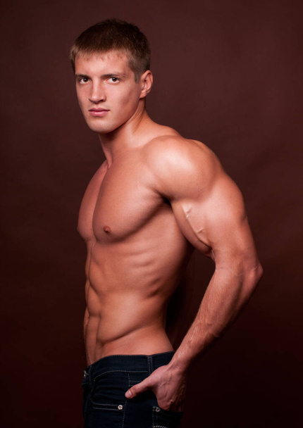 Muscled male model posing in studio - Photo, Image