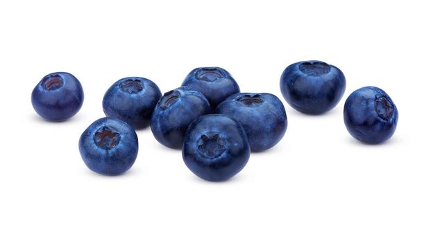 Blueberry isolated on white background. A pile of fresh blueberries, fresh wild berries, ideal for use in packaging, close-up - Photo, Image