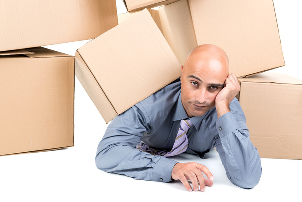 Businessman under boxes - Foto, imagen