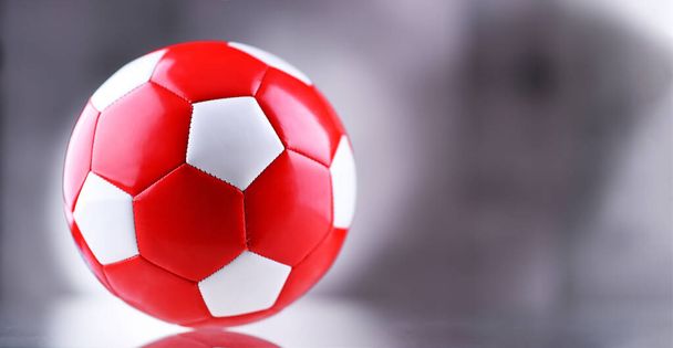 Composition with a leather soccer ball - Foto, afbeelding