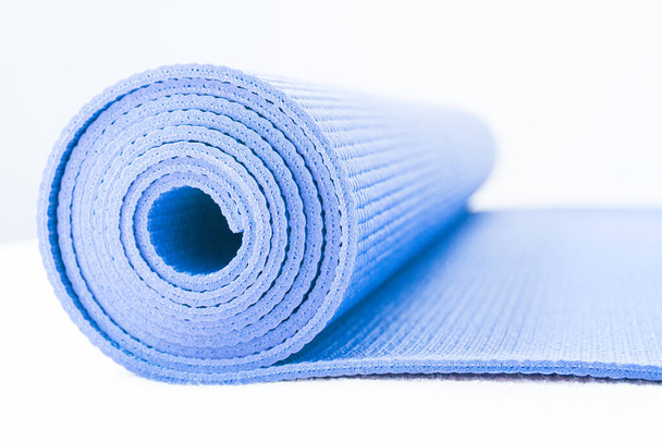 Rolled up yoga or pilates mat. No people - Photo, Image
