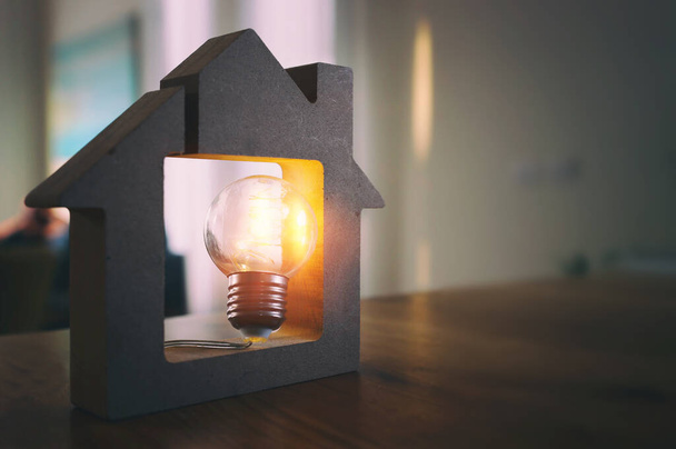 Wood house with Light bulb. energy concept or invention - Fotoğraf, Görsel
