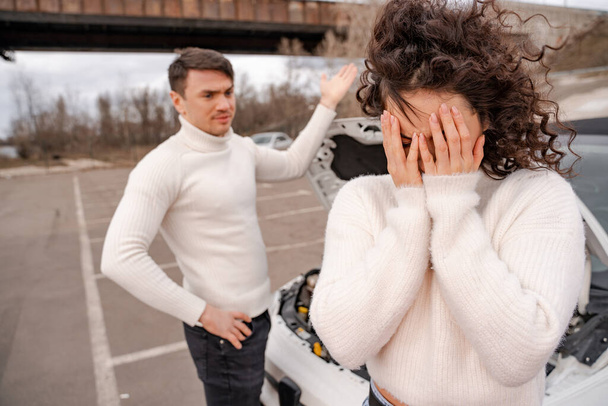 European couple quarrel about the broken automobile - Foto, Bild