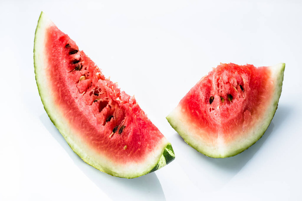 Slices of watermelon isolated on white background. Summer fruit close-up. - Foto, imagen