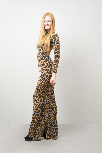 Portrait of a woman in leopard dress - Foto, imagen