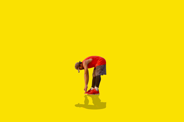 Asian man exercising on colored background  - Zdjęcie, obraz