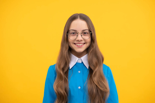 Child development and learning. Girl child in eyeglasses yellow background. Happy childhood. Back to school. September 1. Knowledge day. Basic education. - Photo, Image