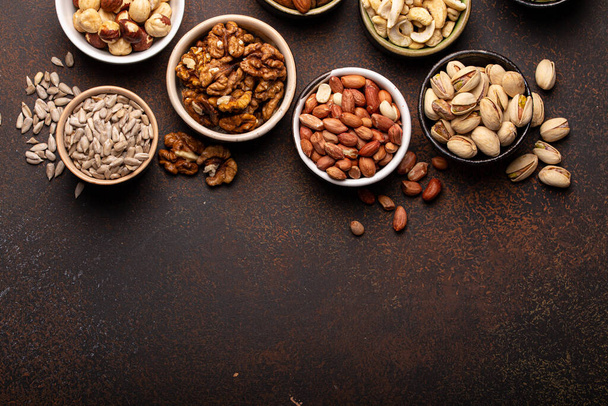Assorted nuts and seeds from above - Photo, Image