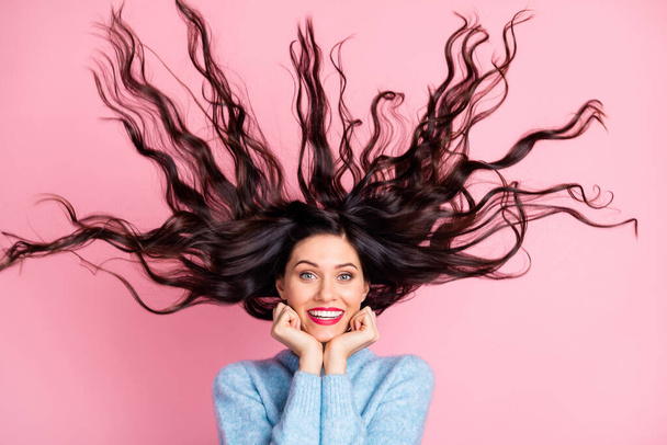 Portrait of pretty positive girl arms on cheeks hair flying toothy smile look camera isolated on pink color background - Φωτογραφία, εικόνα