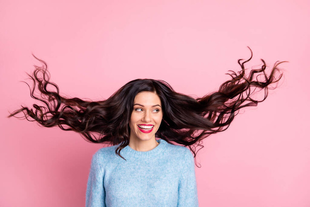 Photo of gorgeous person hair flying look empty space beaming smile isolated on pink color background - Foto, Imagen