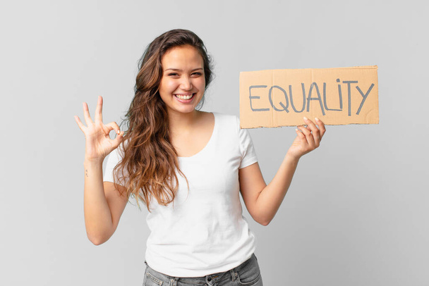 young pretty woman holding a equality banner - Zdjęcie, obraz