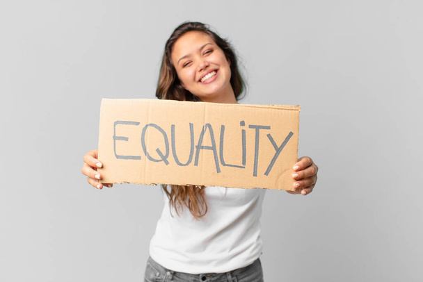 young pretty woman holding a equality banner - 写真・画像