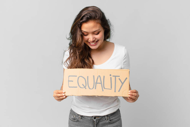 young pretty woman holding a equality banner - Фото, изображение