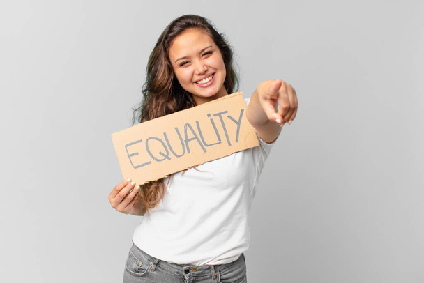 young pretty woman holding a equality banner - Photo, Image
