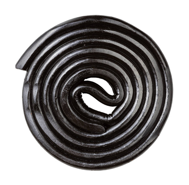 spiraal van zwart drop snoep geïsoleerd op witte achtergrond - Foto, afbeelding