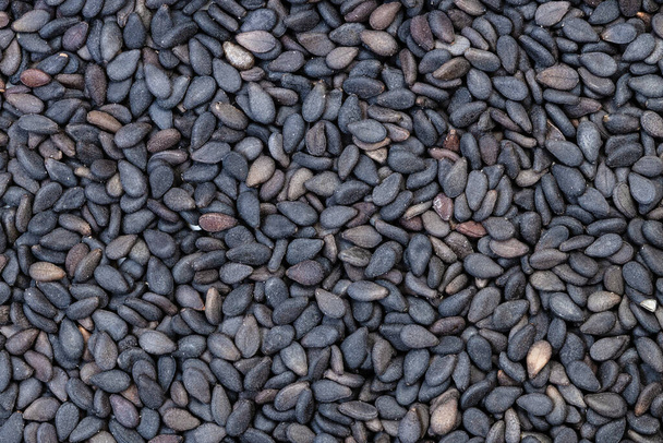 fondo de alimentos - muchas semillas de sésamo negro - Foto, imagen