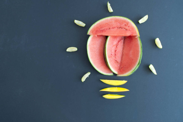 Healthy food ideas concept, light bulb made with watermelon, mango and lime - Foto, Imagen