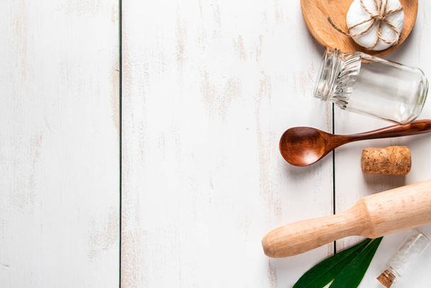 Zero waste concept. Natural recyclable kitchen utensils on a white wooden background. Place for text. - Фото, изображение