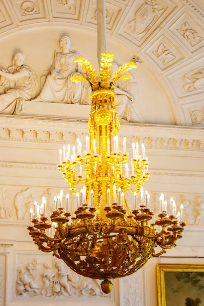 Vintage classical chandelier hanging under a ceiling - Photo, Image