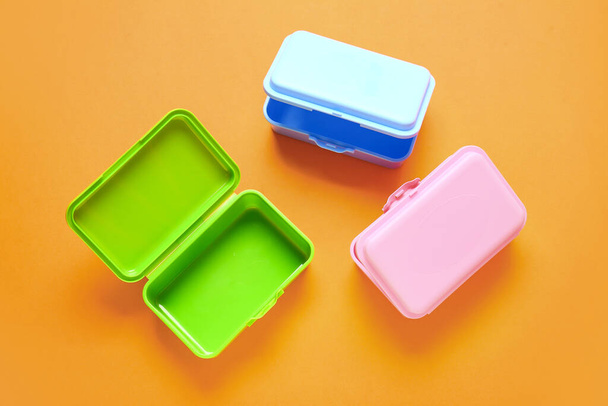 Plastic lunch boxes on color background - Photo, Image