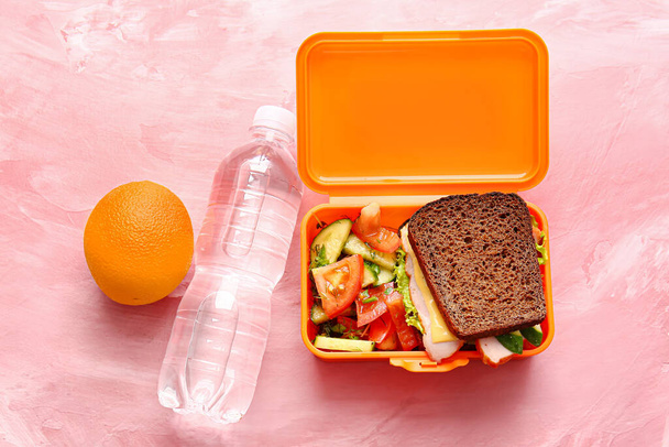 Lunch box with tasty food on color background - Photo, Image