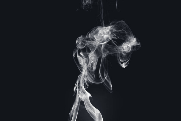 A beautiful view of smoke on a black background - 写真・画像