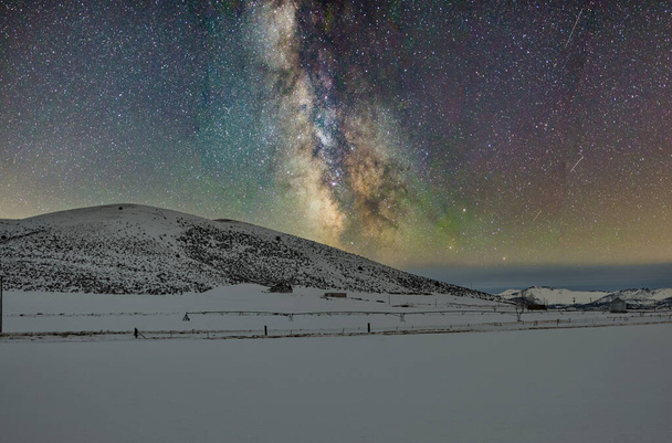 The scenic view of the Milky way over majestic snow mountain - Photo, Image