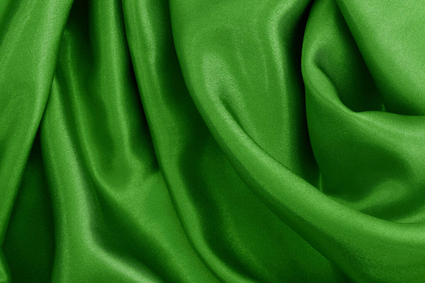 Green fabric texture for background and design art work, beautiful pattern of silk or linen. - Photo, Image